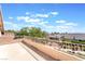 Balcony view featuring desert landscaping and neighborhood homes against a partly cloudy sky at 1016 Eaglewood Dr, Las Vegas, NV 89144