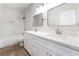 Bathroom featuring double sinks, marble backsplash, and a bathtub at 1016 Eaglewood Dr, Las Vegas, NV 89144