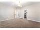 Carpeted bedroom showcasing modern lighting and a closet with ample storage space at 1016 Eaglewood Dr, Las Vegas, NV 89144