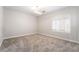 Spacious bedroom with plush carpet, shuttered window, and modern recessed lighting at 1016 Eaglewood Dr, Las Vegas, NV 89144
