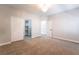 Carpeted bedroom with elegant chandelier and large closet with ample shelving at 1016 Eaglewood Dr, Las Vegas, NV 89144