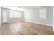 Bright bedroom with plantation shutters and light wood-look flooring at 1016 Eaglewood Dr, Las Vegas, NV 89144