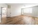 Bedroom featuring wood-look floors and shuttered windows, providing lots of natural light at 1016 Eaglewood Dr, Las Vegas, NV 89144