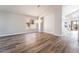 Bright open-concept dining room with hardwood floors, a modern chandelier, and ample space at 1016 Eaglewood Dr, Las Vegas, NV 89144