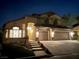 Charming home exterior featuring manicured landscaping, and a spacious two-car garage at 1016 Eaglewood Dr, Las Vegas, NV 89144