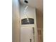 View of the front door with a modern hanging light fixture and window above at 1016 Eaglewood Dr, Las Vegas, NV 89144