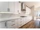 Modern kitchen featuring white cabinets, marble countertops, and stainless steel appliances at 1016 Eaglewood Dr, Las Vegas, NV 89144