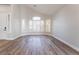 Bright living space with hardwood floors, large window, and plantation shutters at 1016 Eaglewood Dr, Las Vegas, NV 89144