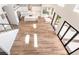 View of the open-concept home featuring wood floors, a kitchen, and sliding glass doors at 1016 Eaglewood Dr, Las Vegas, NV 89144