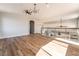 Loft area featuring wood-look flooring, glass railing, and ample natural light at 1016 Eaglewood Dr, Las Vegas, NV 89144