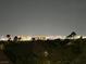 Night view of the glittering city lights from the property, creating a vibrant backdrop at 1016 Eaglewood Dr, Las Vegas, NV 89144