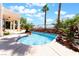 Backyard pool with desert rock detail and mature landscaping at 1016 Eaglewood Dr, Las Vegas, NV 89144