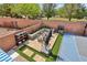 Backyard aerial view featuring a basketball court, comfortable seating, landscaping, and mature trees at 10329 Walworth Ave, Las Vegas, NV 89166
