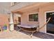 Relaxing backyard with a cozy hammock on a brick patio under a covered porch at 10329 Walworth Ave, Las Vegas, NV 89166