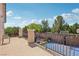 Backyard patio with basketball court, wrought iron railing, and outdoor lighting at 10329 Walworth Ave, Las Vegas, NV 89166