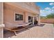 Backyard patio with a hammock and space for outdoor entertaining under a covered porch at 10329 Walworth Ave, Las Vegas, NV 89166