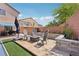 Cozy backyard patio area with comfortable seating, lush landscaping, and ample space for outdoor entertainment at 10329 Walworth Ave, Las Vegas, NV 89166