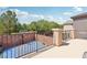 Backyard patio with basketball court, wrought iron railing, and exterior columns at 10329 Walworth Ave, Las Vegas, NV 89166