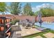 Backyard featuring a basketball court, seating area, planters, decor, and lush trees at 10329 Walworth Ave, Las Vegas, NV 89166