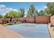 Outdoor basketball court featuring a lounge area, encased by a brick wall and brick paver trim at 10329 Walworth Ave, Las Vegas, NV 89166