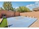 Full backyard basketball court featuring a modern design, surrounding block wall, and landscaping at 10329 Walworth Ave, Las Vegas, NV 89166