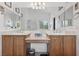 Bathroom with double sinks, spacious countertops, large mirror, and bright vanity lighting at 10329 Walworth Ave, Las Vegas, NV 89166