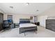 Large primary bedroom with office space, complemented by modern furnishings and neutral tones at 10329 Walworth Ave, Las Vegas, NV 89166