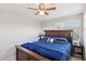 Bright bedroom featuring a ceiling fan and sizable windows providing natural light and external views at 10329 Walworth Ave, Las Vegas, NV 89166