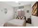 Cozy bedroom featuring neutral tones, natural light, and contemporary décor for a relaxing atmosphere at 10329 Walworth Ave, Las Vegas, NV 89166