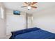Comfortable bedroom with a ceiling fan, well-lit by natural light from window to the right at 10329 Walworth Ave, Las Vegas, NV 89166