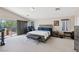 Spacious primary bedroom with a workstation, desk and a private outdoor balcony at 10329 Walworth Ave, Las Vegas, NV 89166