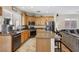Spacious kitchen features granite counters, stainless appliances, and natural wood cabinets at 10329 Walworth Ave, Las Vegas, NV 89166