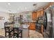 Well-equipped kitchen featuring stainless steel appliances, granite countertops, and a cozy breakfast bar at 10329 Walworth Ave, Las Vegas, NV 89166