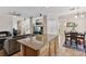 Open floor plan showcasing granite countertops and a seamless flow between the kitchen, living, and dining areas at 10329 Walworth Ave, Las Vegas, NV 89166