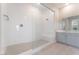 Modern bathroom featuring a glass-enclosed shower with bench and neutral tiled floors at 128 Los Cabos Dr # 301, Las Vegas, NV 89144