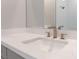 Bathroom vanity featuring a white countertop, integrated sink, and modern faucet at 128 Los Cabos Dr # 301, Las Vegas, NV 89144