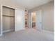Neutral carpeted bedroom with adjacent closet and bathroom access at 128 Los Cabos Dr # 301, Las Vegas, NV 89144