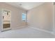Bright bedroom with neutral carpet and access to outdoor balcony at 128 Los Cabos Dr # 301, Las Vegas, NV 89144