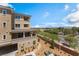 Exterior view of the property featuring architecture, landscaping, and a glimpse of the surrounding neighborhood at 128 Los Cabos Dr # 301, Las Vegas, NV 89144
