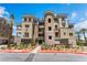 Beautiful multi-story building with desert landscaping and a unique rounded tower feature at 128 Los Cabos Dr # 301, Las Vegas, NV 89144