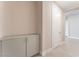 Inviting hallway featuring built-in storage cabinets and a doorway leading to another room at 128 Los Cabos Dr # 301, Las Vegas, NV 89144