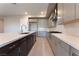 Modern kitchen featuring a large island, sleek countertops, and stainless steel appliances at 128 Los Cabos Dr # 301, Las Vegas, NV 89144