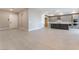 Spacious living area with an open concept leading to the kitchen, bathed in natural light at 128 Los Cabos Dr # 301, Las Vegas, NV 89144
