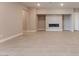 Spacious living area with contemporary fireplace, neutral color scheme, and tile flooring at 128 Los Cabos Dr # 301, Las Vegas, NV 89144