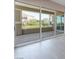 Sliding glass doors to the patio overlooking landscaped grounds and building at 128 Los Cabos Dr # 301, Las Vegas, NV 89144