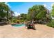 Tranquil pool area with a relaxing seating and gazebo surrounded by beautiful landscaping at 128 Los Cabos Dr # 301, Las Vegas, NV 89144