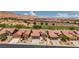 A scenic aerial view of homes in a golf course community with desert landscape at 1407 Wheelwright Ct, Mesquite, NV 89034