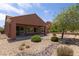 Relaxing backyard with covered patio, rock landscaping and golf course views at 1407 Wheelwright Ct, Mesquite, NV 89034