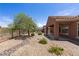 Charming backyard featuring decorative rock, patio, and a view of the golf course at 1407 Wheelwright Ct, Mesquite, NV 89034