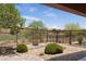 Manicured backyard with rock landscaping offers scenic views of the golf course and desert vegetation at 1407 Wheelwright Ct, Mesquite, NV 89034